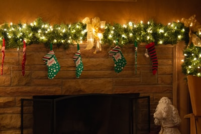 Christmas stockings hanging on the wall lamps
